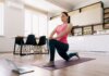 Tips to Organizing Your Home Workout Attractive woman practicing yoga at home using online training instructions